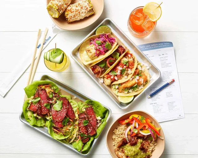 Tacos, street corn, a rice bowl and drinks at bartaco